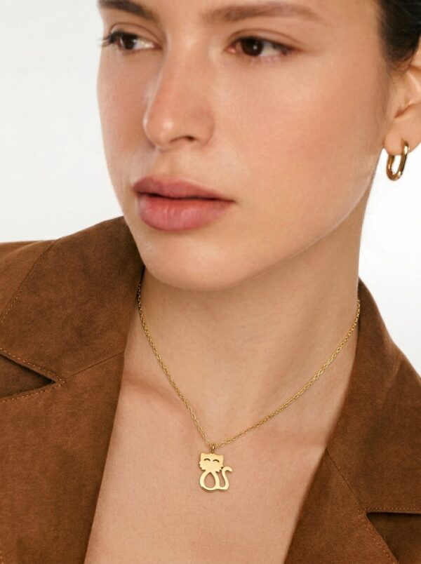 Kitty Selfie Pendant in 18k yellow gold worn on a fine chain at the collarbone