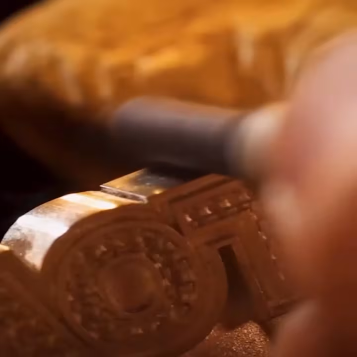 A jeweller handcrafting a custom piece in the Empire workshop