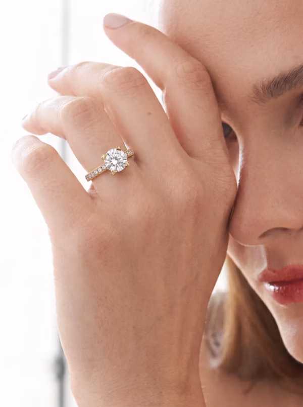 Round Pavé Solitaire Engagement Ring worn on the hand, showing the raised round centre stone